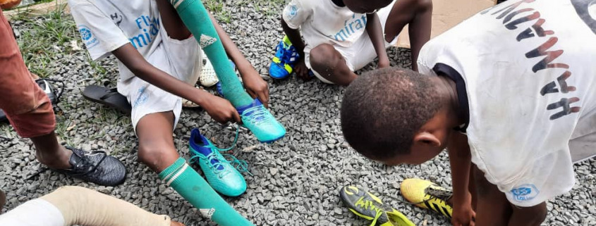 Children trying their new rugby boots